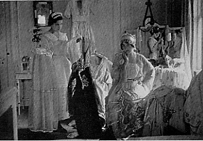 Clara Kimball Young deciding what to wear