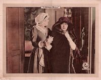 Film still from Madame X, Her maid helps her sneak in