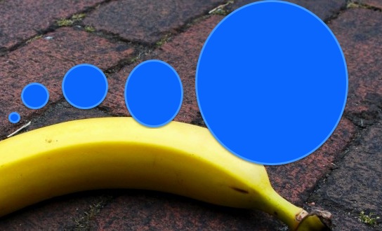 yellow banana with blue circles painted in post