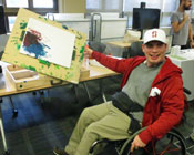 Danny shows off his artwork using an easel from a 2018 student project