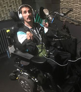 Photo of Nathan in a recording studio