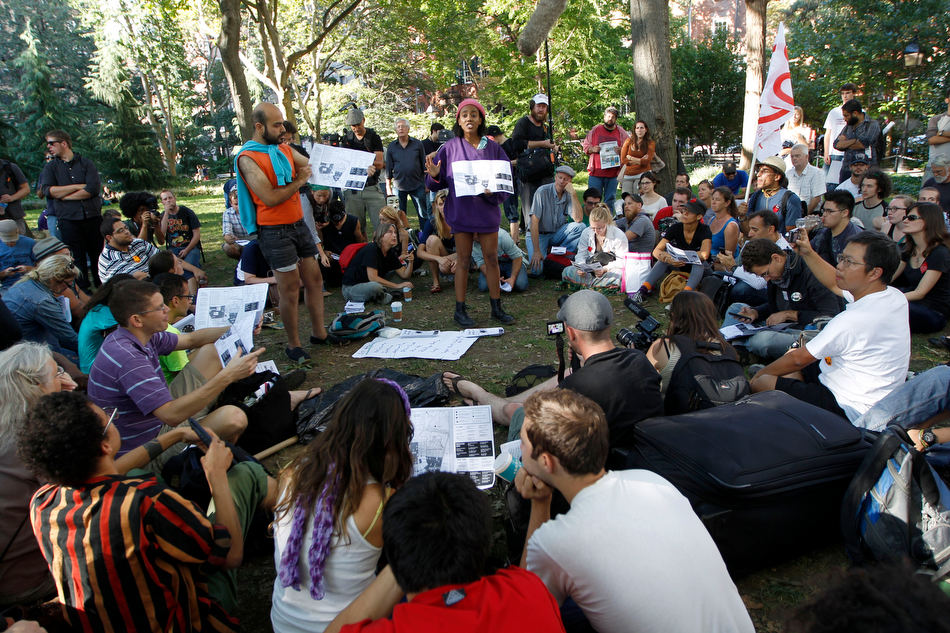 Activists associated with the
              Occupy Wall Street movement participate in a general
              assembly during a gathering of the movement in Washington
              Square park, Saturday, Sept. 15, 2012 in New York.. (AP
              Photo/Mary Altaffer). From
http://blogs.pjstar.com/eye/2012/09/17/occupy-wall-street-celebrates-a-year-of-protests