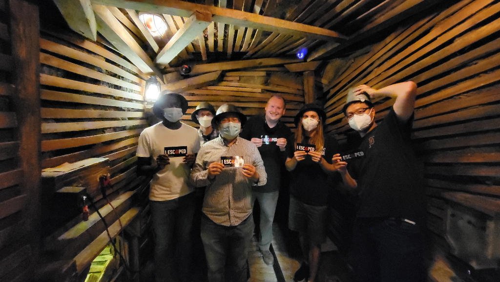 Photo of group in a replica mine in an escape room