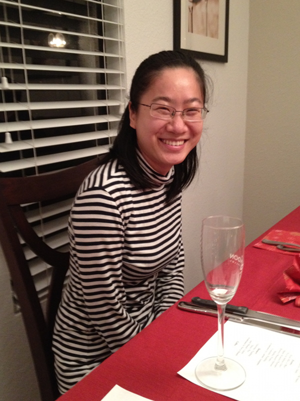 Photo of a person at a dinner table