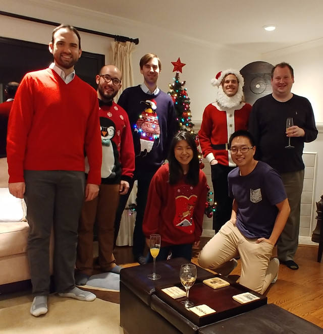 Group of people in Christmas sweatshirts