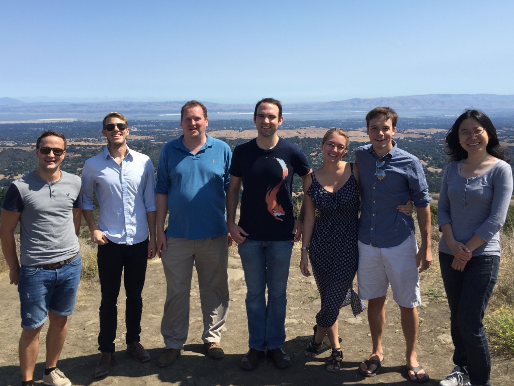 Photo of a group of people on a hill overlooking the Bay Area