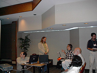 Greg Lesher (kneeling at laptop), Jeff Higginbotham (standing, center of picture), and Kevin Caves (far right)
