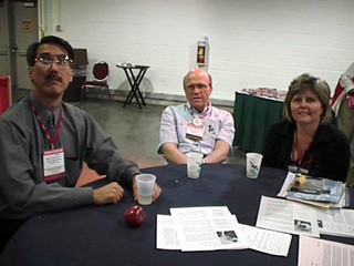 Roger O. Smith, Al Cook (RESNA President), and Susan Hussey in the exhibit hall