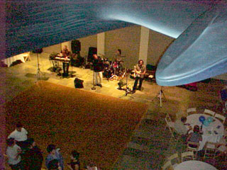 The band plays under the whale