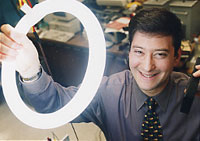 photo of inventor and fluorscent tube