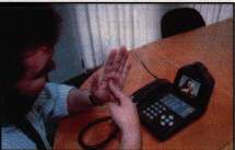 A videophone enables the transmission and reception of sign language.