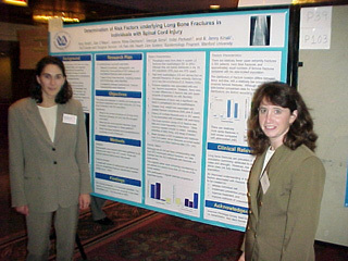 Two of Jenny's students at their poster
