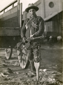 Photograph of a revolutionary with a wooden leg holding a rifle