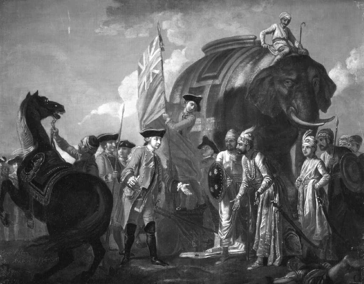 This circa 1760 oil painting by Francis Hayman depicts Lord Robert Clive and Mir Jafar, who ruled on behalf of the British East India Company in India. The scene shows British officers in red military uniforms alongside a Union Jack flag, while Indian figures wear traditional ornate clothing and turbans. A large elephant with rider looms in the background.