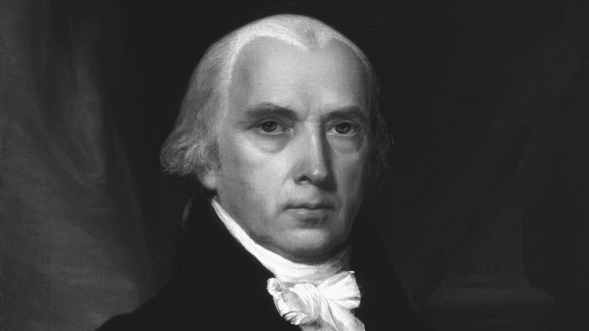 A close-up on the face from an 1816 oil portrait of James Madison by John Vanderlyn. He wears a black coat and a white neck cloth, and his gray hair has a prominent widowâ€™s peak. He is turned slightly to his left but looks straight at the viewer.