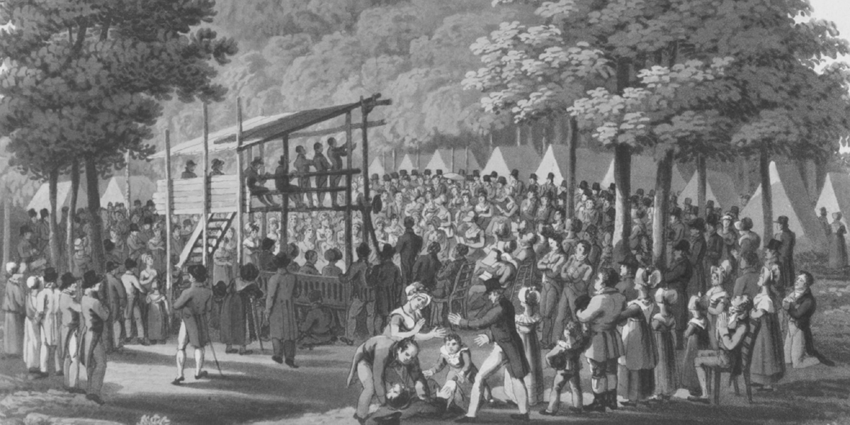 This 1819 illustration by M. Dubourg, Camp Meeting of the Methodists in N. America, depicts a Methodist camp revival meeting during the Second Great Awakening. A crowd of hundreds of people stand on their feet in a forest clearing, around a raised wooden pulpit, looking up at a series of ministers taking stand in the pulpit. Some of the people in the back of the crowd are on their knees praying. In the middle of the foreground several people are tending to a man that has fainted. In the background rows of white tents can be seen mixed into the tree line.