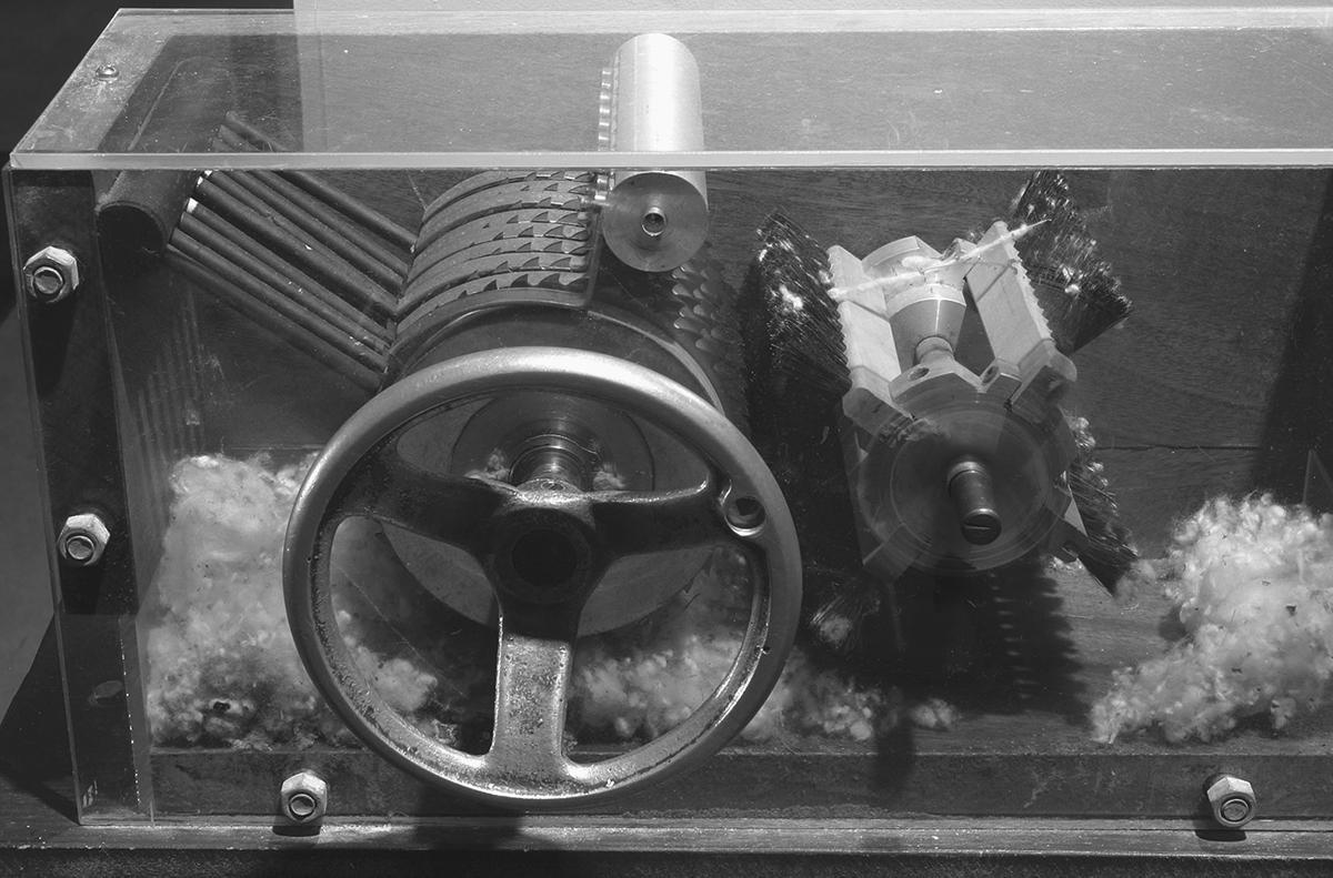 This is a photograph of a nineteenth-century cotton gin on display at the Eli Whitney Museum.