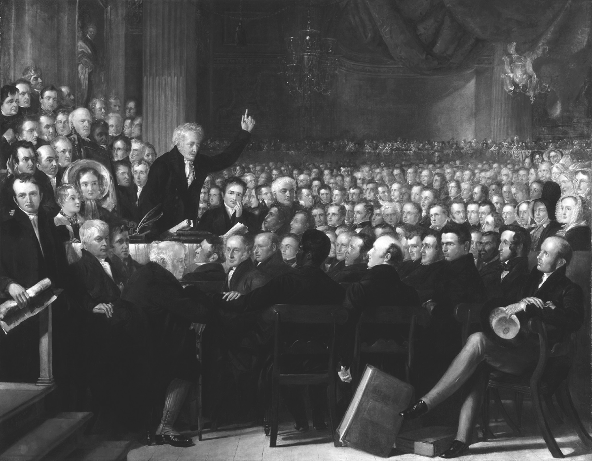 This 1840 painting by Benjamin Haydon, The Anti-Slavery Society Convention, depicts Thomas Clarksonâ€™s address. Thomas is at a podium in an assembly hall delivering a rousing speech to a crowded room with hundreds of people extending into a dim background.