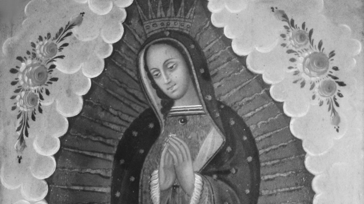 In this painting, Mary as the Virgin of Guadelupe is wearing a crown serenely folds her hands and is adorned by the tilma (peasant cloak) of Juan Diego, on which, according to his story, appeared the image of the Virgin of Guadalupe. Sun rays appear to come from her. The upper two corners are painted in a teal color and embellished with pink roses.