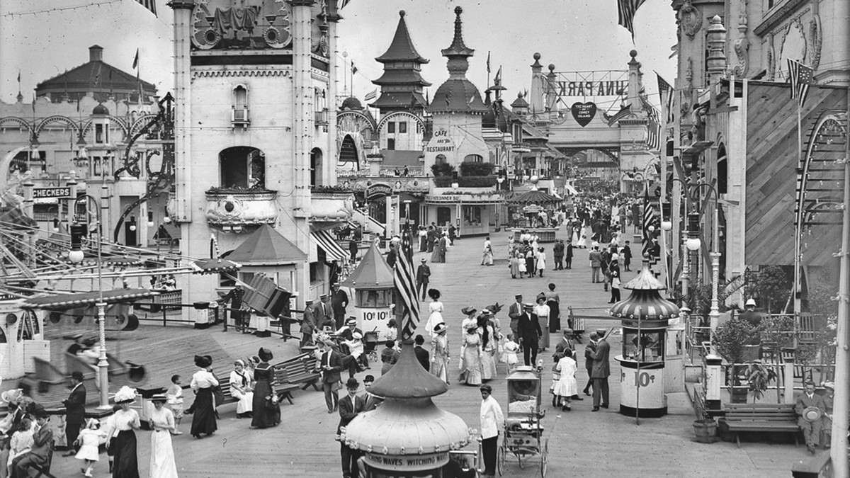A crowded scene of an amusement park.