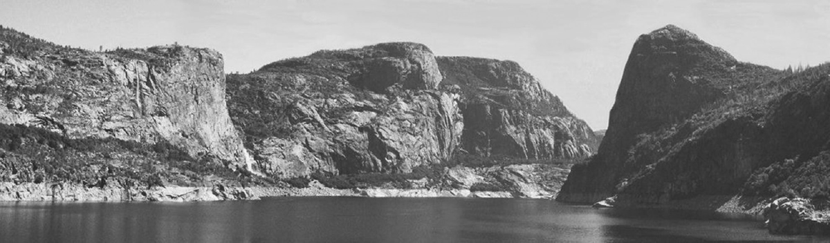 A large lake or river winds its way through mountain cliffs.