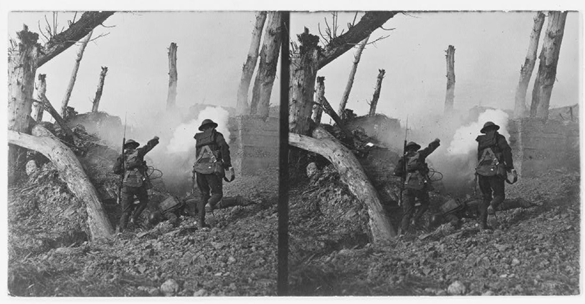 Two soldiers in a denuded landscape charge a bunker.
