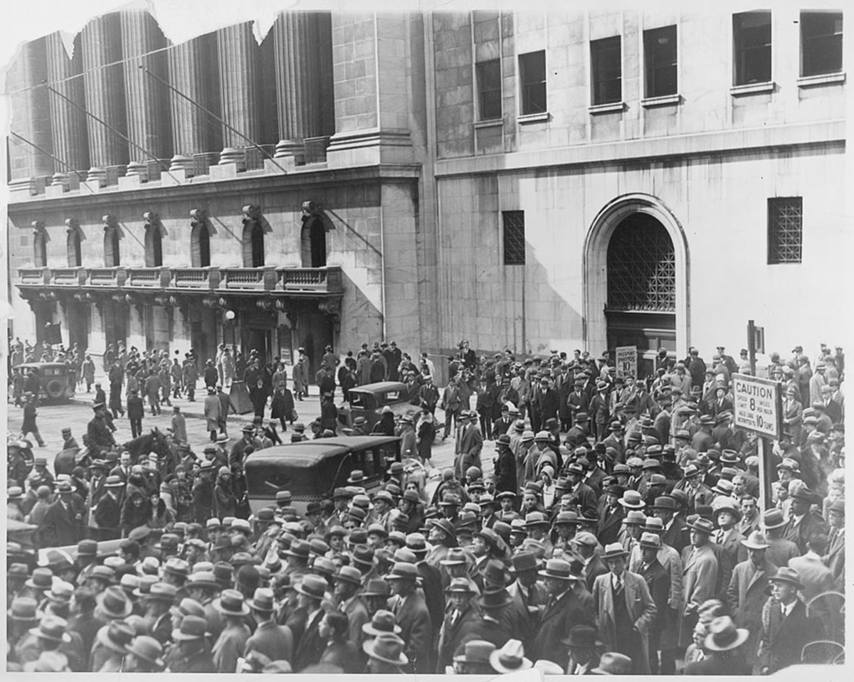 Crowds gather outside of a building.