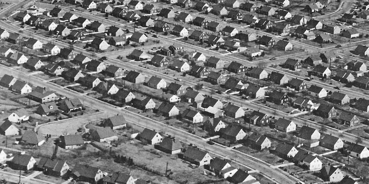 Long rows of small tract homes line multiple streets.