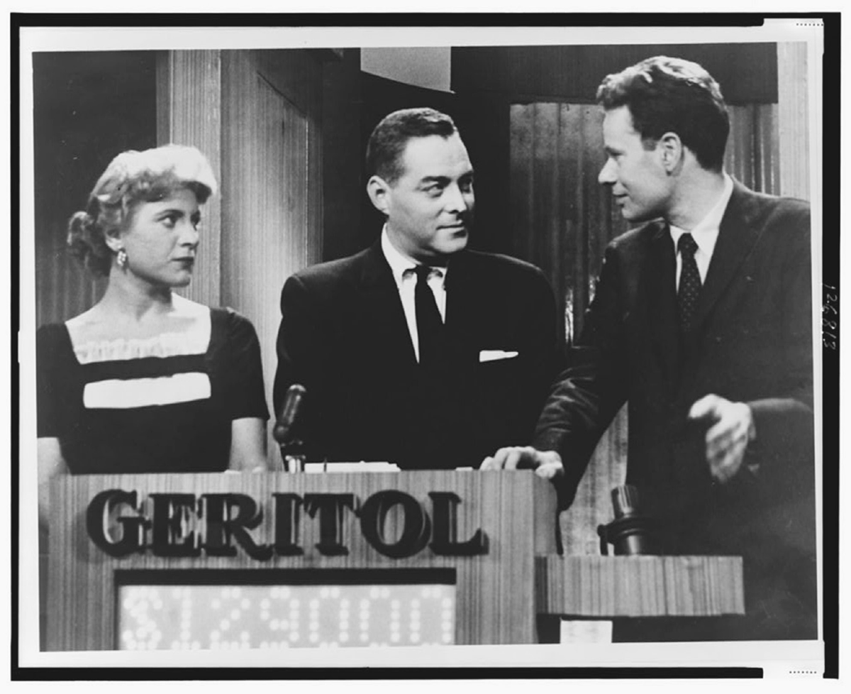 Scene of a man and woman competing on a game show.