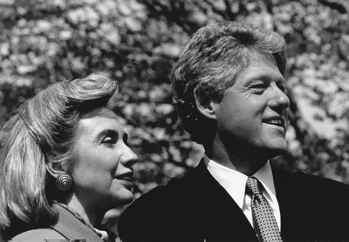 A close-in portrait of a man and a woman in profile.