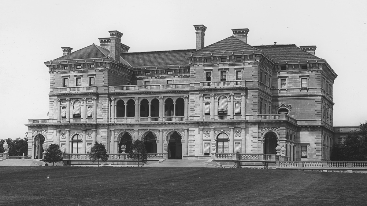 The exterior of an opulent three-story mansion.