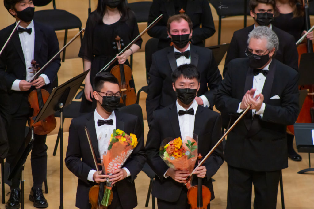 Richard Cheung '24 (L) and Roger Xia '24 (R) with the Stanford Philharmonia ?: Jennifer Xiong